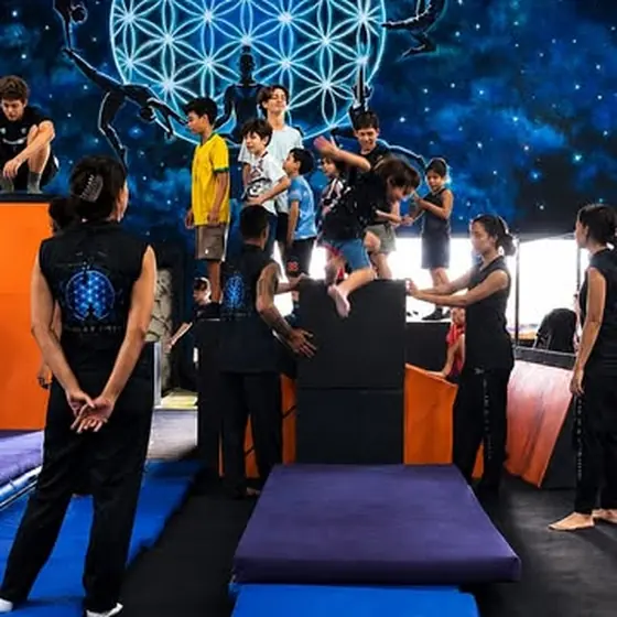 A kids group in the training room at Planet Circus Movement